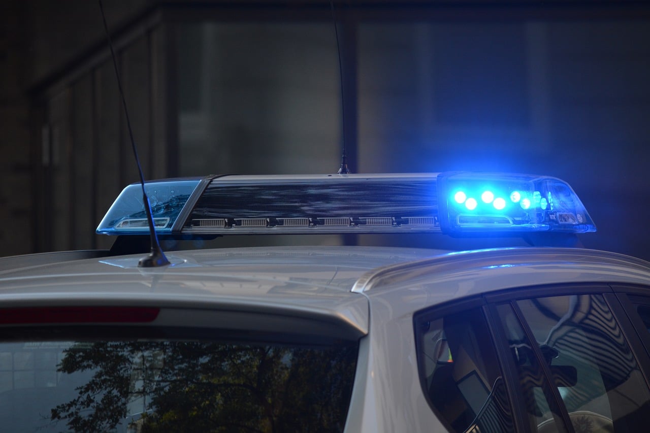 police ar with lights on