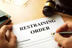 person sighning restraining order