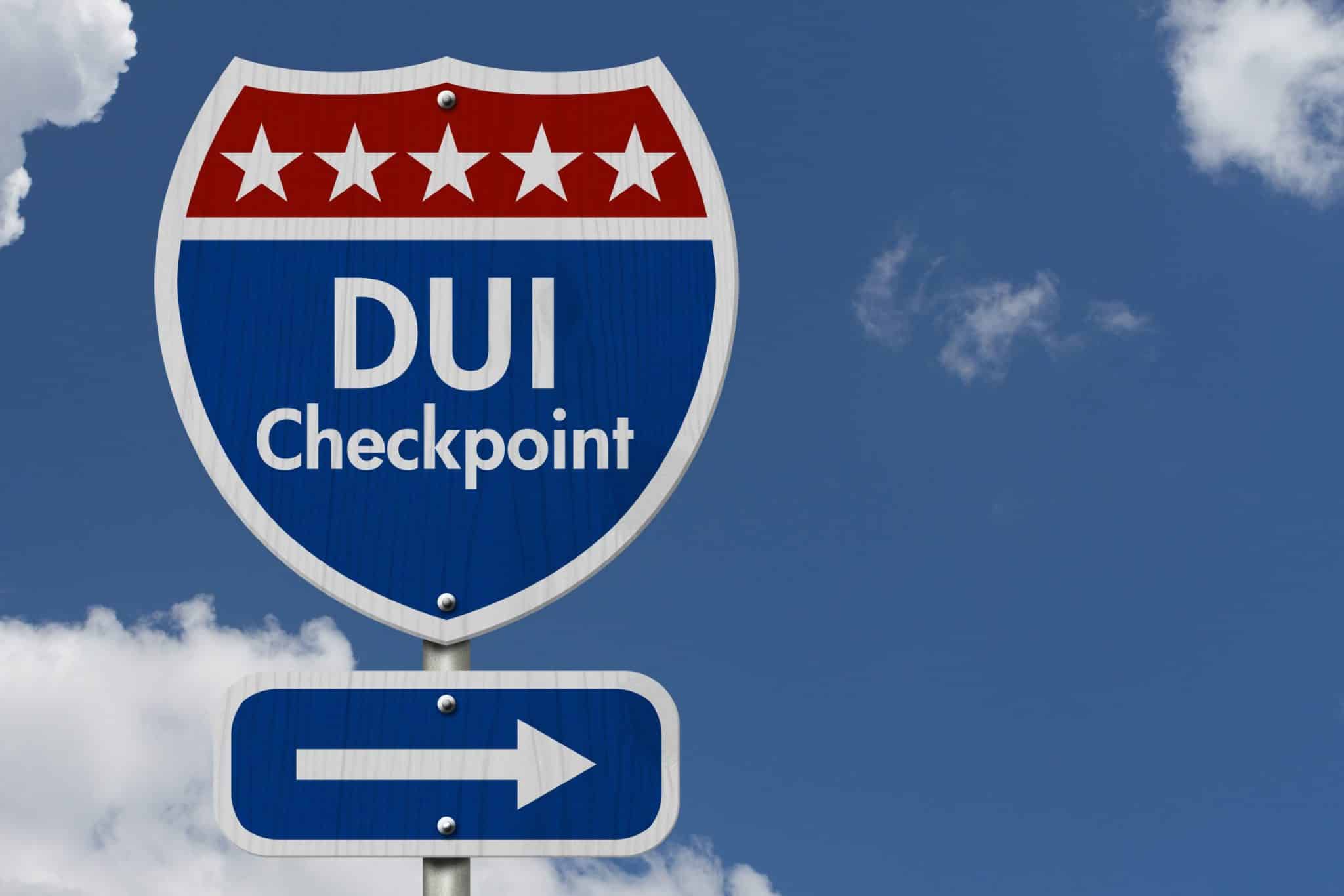 road sign saying multiple "DUI Checkpoint"