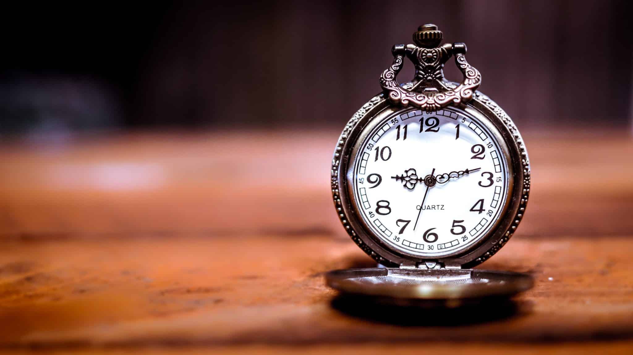 desk clock sitting on table